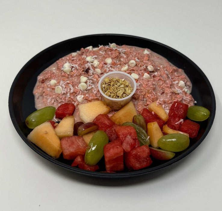 Delicious strawberry protein oatmeal infused with strawberries, coconut, and vanilla yogurt chips paired with a fresh fruit salad - Sparta NJ Meal Preps