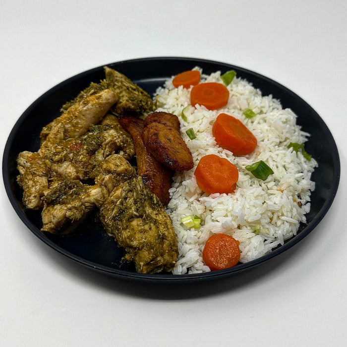 Delicious chicken cubes tossed in house green sauce paired with jasmine rice, carrots, and sweet plantains. This is a must-try meal! - Spartan Meal Preps Franklin Lakes New Jersey Meal Prep Company