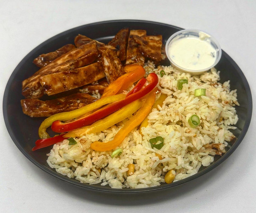 Grilled chicken paired with jasmine rice mixed with corn and paired with peppers and house tzatziki sauce - Carlstadt NJ Meal Preps