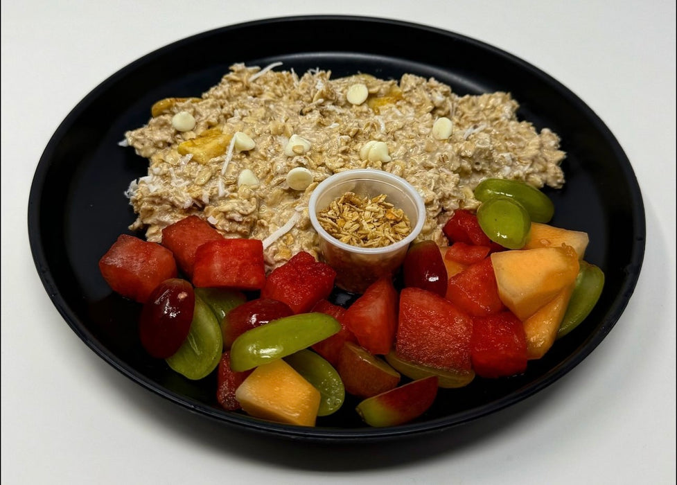 Delicious Banana protein oatmeal infused with coconut, banana, and vanilla yogurt chips paired with a fresh fruit salad - Clifton Nj Meal Preps