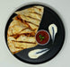 Quesadillas on a black plate with salsa and sour cream on a light gray background
