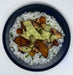 Plated dish with rice, chicken, and vegetables on a white background