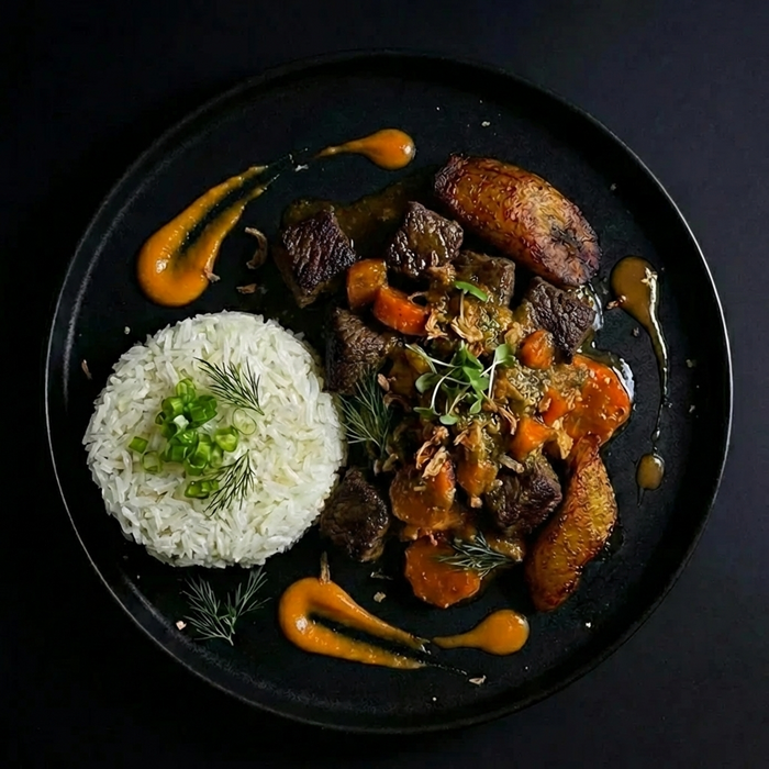 Plated dish with rice, meat, and vegetables on a dark background