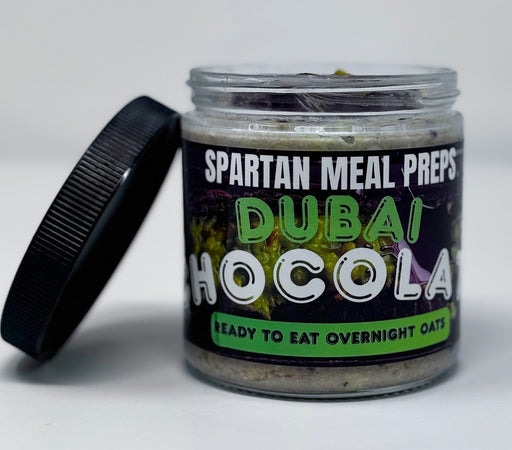 Jar of Spartan Meal Preps Dubai Hocola overnight oats with a black lid on a white background