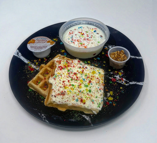Plate with waffles, ice cream, and granola on a white background a meal made by spartan meal preps new jersey