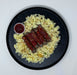 Plate with scrambled eggs, sausages, and ketchup on a white background made by spartan meal preps a new jersey meal prep company