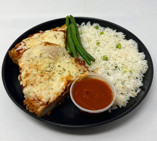 Parmesan Crusted Chicken - Spartanmealpreps-glenrocknjmealprepdeliveryservice - crusted chicken paired with jasmine rice and a marinara sauce cup put on a black plate.
