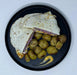 Quesadillas with potato salad on a black plate