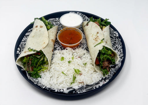 Plated meal with tortillas, rice, and sauces on a decorative plate.