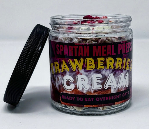 Jar of Spartan Meal Prep Strawberries & Cream overnight oats with a black lid on a white background