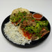 Spartan meal preps - Shredded steak tacos - nj meal prep - two tacos paired with rice and sauce cup on a black plate. 