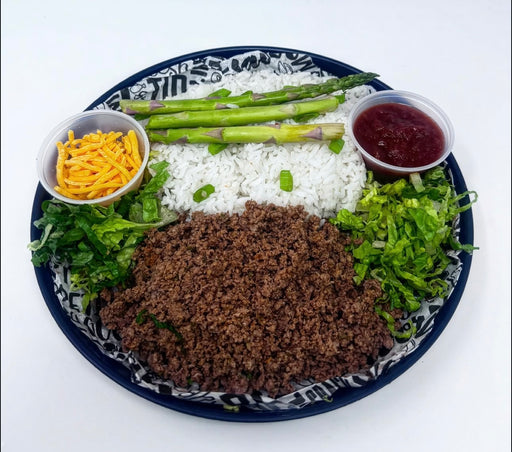 A prepared ground beef taco bowl meal consisting of seasoned ground beef, jasmine rice, black beans, corn, lettuce, cheddar cheese, and house salsa. Spartan meal preps a new york meal prep delivery comapny.