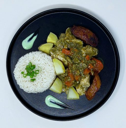 Delicious chicken cubes tossed in house green sauce paired with jasmine rice, carrots, and sweet plantains. This is a must-try meal! - Spartan Meal Preps Franklin Lakes New Jersey Meal Prep Company