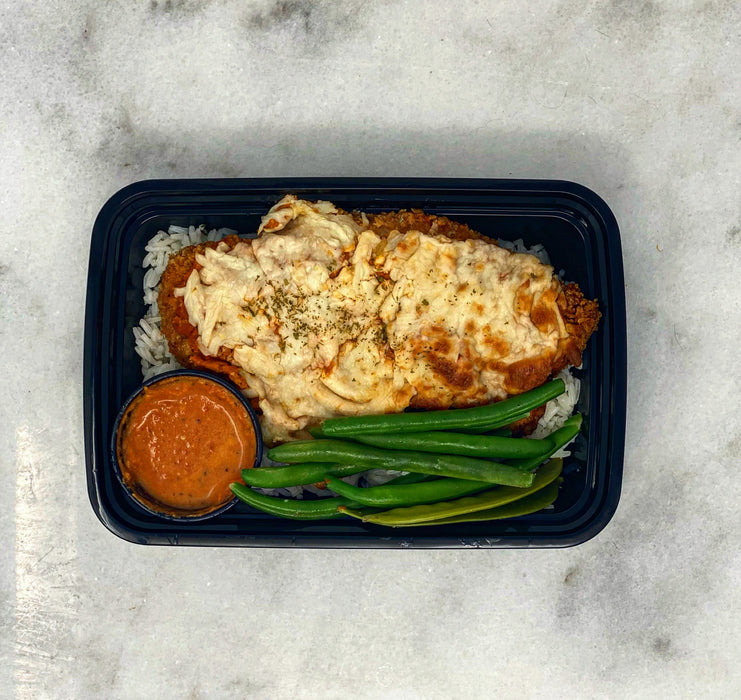 Chicken parm over bed of jasmine rice paired with green beans and vodka sauce cup. - nj meal prep delivery service