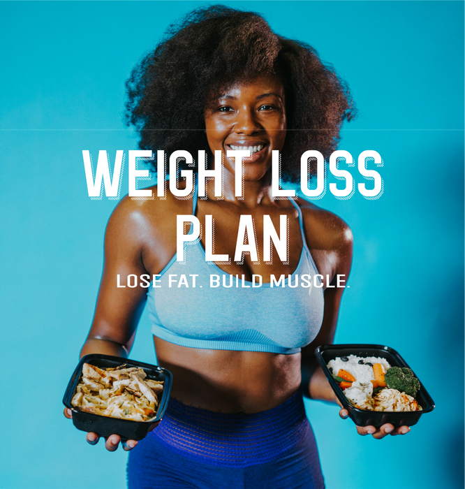Weight loss model holding spartan meal preps smiling and in shape